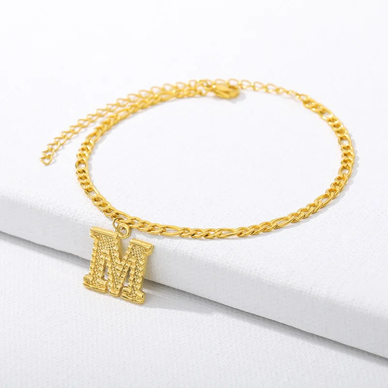 Shine bright with our Vintage 26 Initial Letter Gold-Plated Cuban Chain Anklet – perfect for adding a personal touch to your summer style! ✨🦵💖