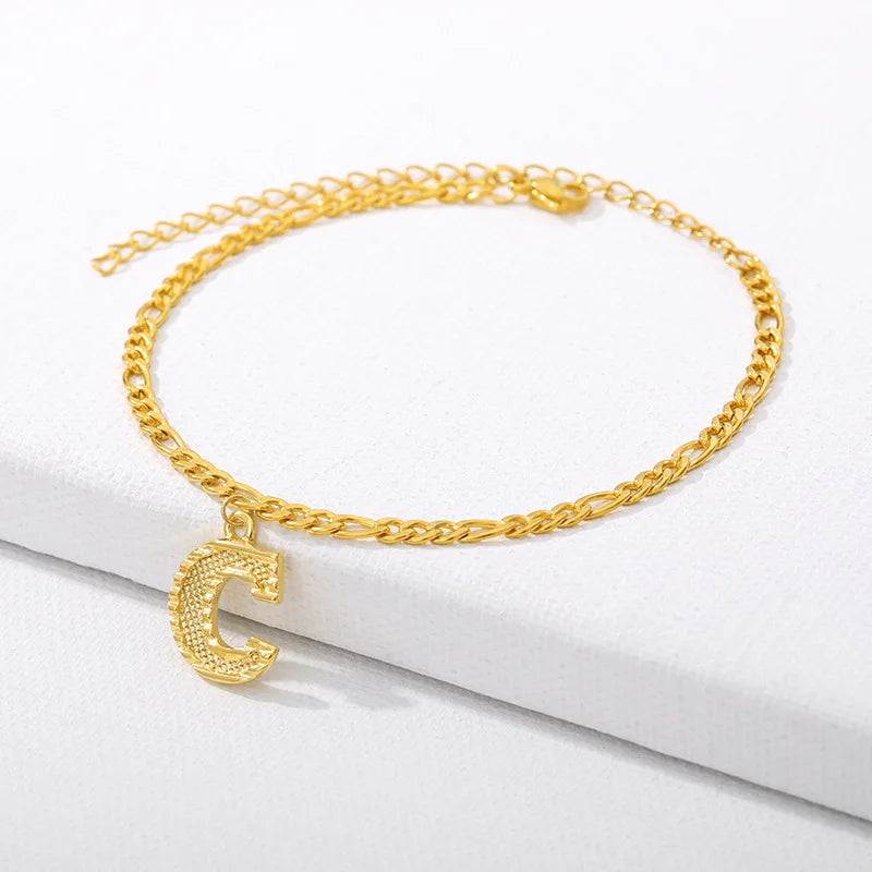 Shine bright with our Vintage 26 Initial Letter Gold-Plated Cuban Chain Anklet – perfect for adding a personal touch to your summer style! ✨🦵💖
