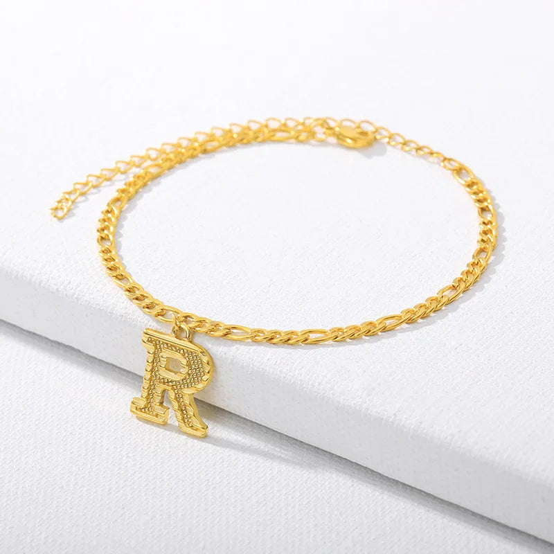 Shine bright with our Vintage 26 Initial Letter Gold-Plated Cuban Chain Anklet – perfect for adding a personal touch to your summer style! ✨🦵💖