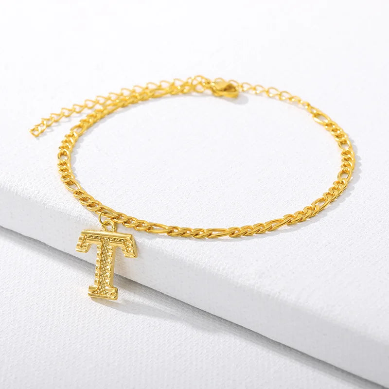 Shine bright with our Vintage 26 Initial Letter Gold-Plated Cuban Chain Anklet – perfect for adding a personal touch to your summer style! ✨🦵💖