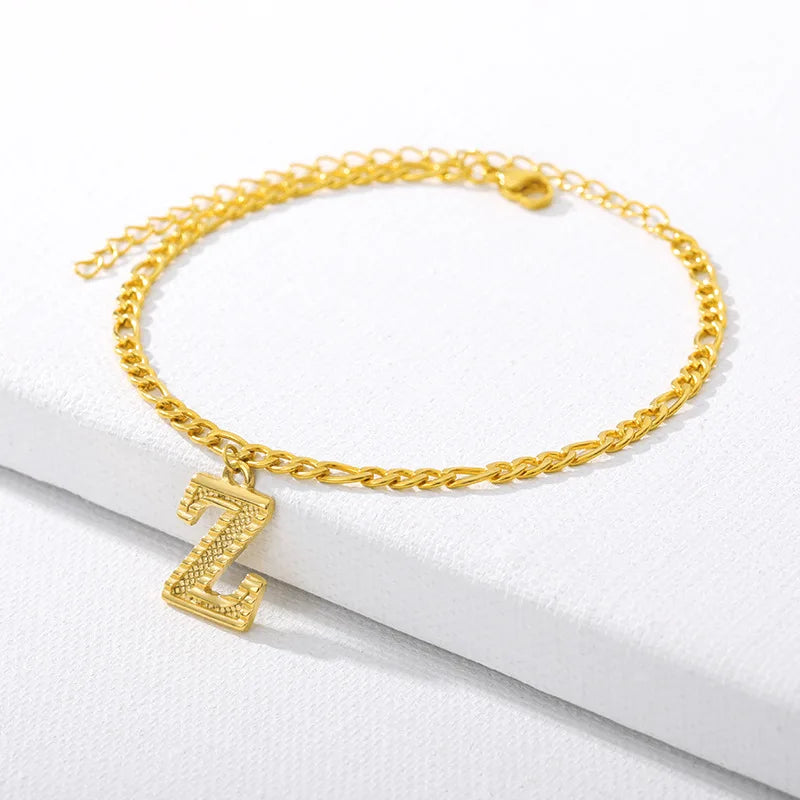 Shine bright with our Vintage 26 Initial Letter Gold-Plated Cuban Chain Anklet – perfect for adding a personal touch to your summer style! ✨🦵💖
