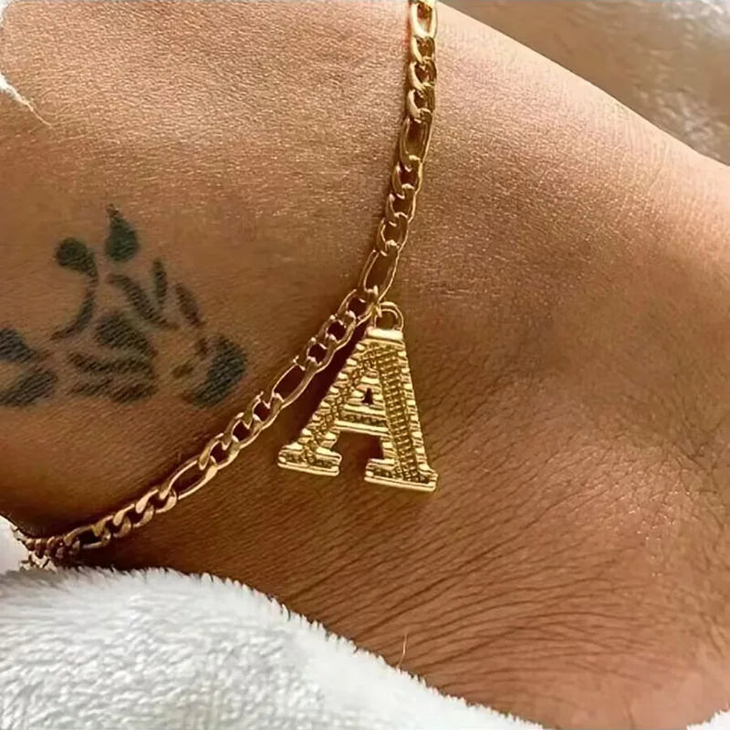 Shine bright with our Vintage 26 Initial Letter Gold-Plated Cuban Chain Anklet – perfect for adding a personal touch to your summer style! ✨🦵💖
