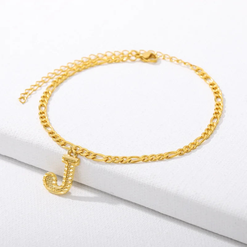 Shine bright with our Vintage 26 Initial Letter Gold-Plated Cuban Chain Anklet – perfect for adding a personal touch to your summer style! ✨🦵💖