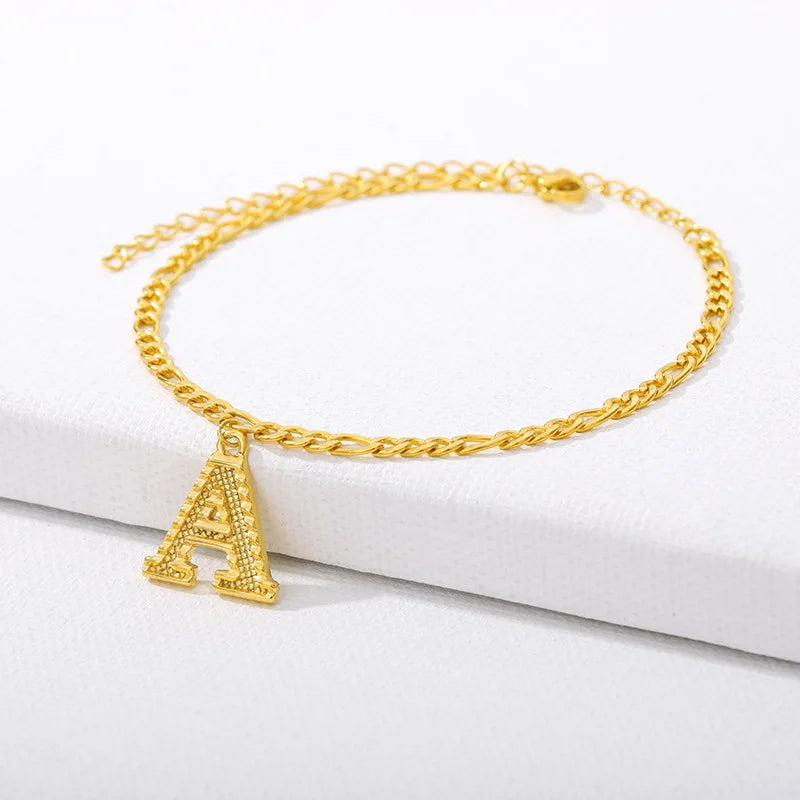 Shine bright with our Vintage 26 Initial Letter Gold-Plated Cuban Chain Anklet – perfect for adding a personal touch to your summer style! ✨🦵💖