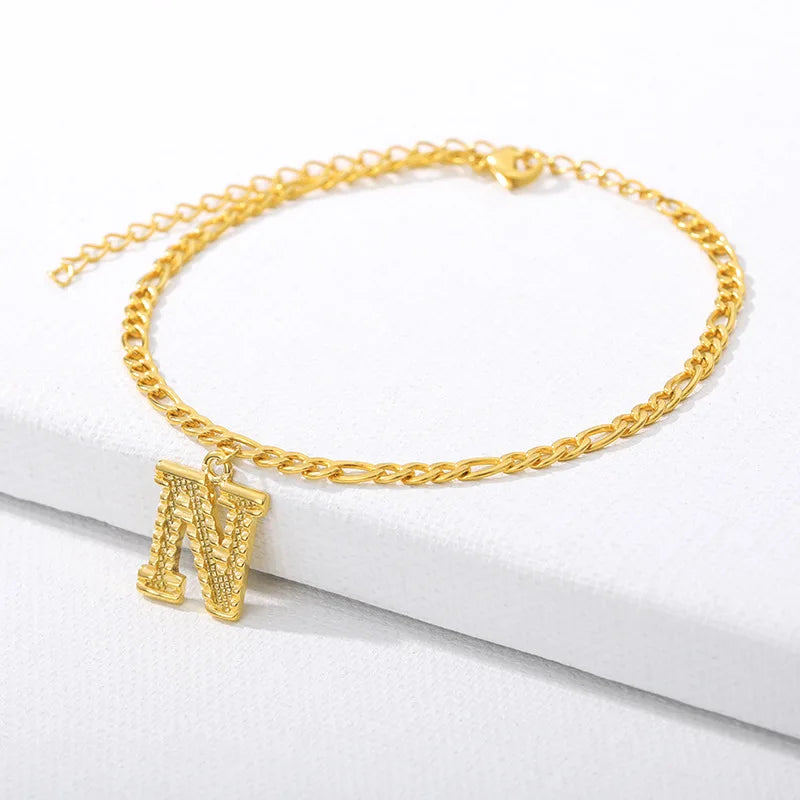 Shine bright with our Vintage 26 Initial Letter Gold-Plated Cuban Chain Anklet – perfect for adding a personal touch to your summer style! ✨🦵💖
