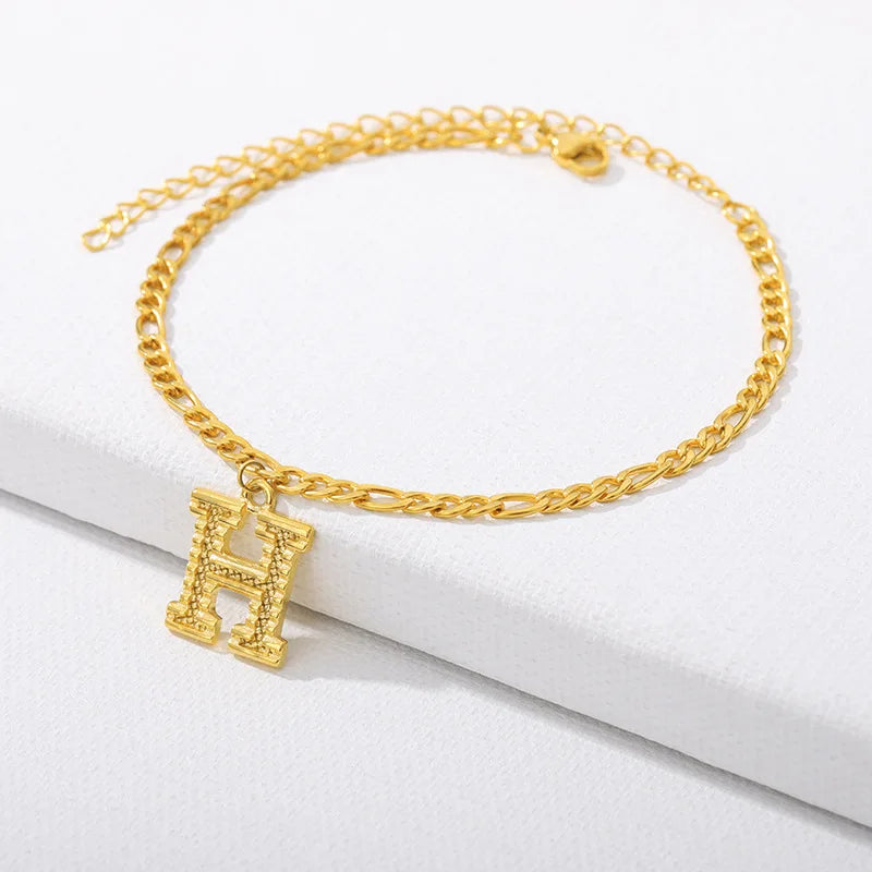 Shine bright with our Vintage 26 Initial Letter Gold-Plated Cuban Chain Anklet – perfect for adding a personal touch to your summer style! ✨🦵💖
